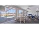 Enclosed lanai with outdoor dining, bright light, and views of the pool and waterfront at 18662 Arapahoe Cir, Port Charlotte, FL 33948
