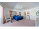 Relaxing main bedroom features a ceiling fan, lots of space, and cozy decor at 18662 Arapahoe Cir, Port Charlotte, FL 33948