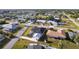 This aerial view showcases a neighborhood featuring well-maintained homes and neatly landscaped yards at 20339 Gentry Ave, Port Charlotte, FL 33952