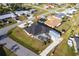 Birds-eye view of a charming residence boasting a well-maintained yard, a private pool, and a separate storage building at 20339 Gentry Ave, Port Charlotte, FL 33952