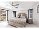 Well-lit bedroom with modern furnishings, including a plush bed and sleek nightstands at 20339 Gentry Ave, Port Charlotte, FL 33952
