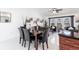 Elegant dining area with a marble table, leather chairs, and modern lighting at 20339 Gentry Ave, Port Charlotte, FL 33952