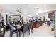 Open-concept dining area connected to living space with marble table and modern design at 20339 Gentry Ave, Port Charlotte, FL 33952