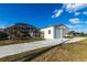 Exterior showcasing large garage and screened in patio of the home, perfect for enjoying the outdoors at 20339 Gentry Ave, Port Charlotte, FL 33952