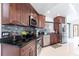 Kitchen with stainless steel appliances, dark countertops, and backsplash at 20339 Gentry Ave, Port Charlotte, FL 33952