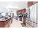 Modern kitchen with stainless appliances, dark wood cabinets, an island and open to the living area at 20339 Gentry Ave, Port Charlotte, FL 33952