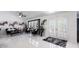 Inviting living room with white tile floors, comfortable seating, and stylish decor at 20339 Gentry Ave, Port Charlotte, FL 33952
