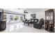 Bright living room with large window, modern furniture, and sleek tile flooring at 20339 Gentry Ave, Port Charlotte, FL 33952