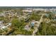 Aerial view of a property with a canal, pool, and easy access to nearby shopping and roadways at 2091 Cannolot Blvd, Port Charlotte, FL 33948