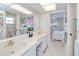 Bright bathroom with double vanity and access to bedroom at 2180 Via Esplanade, Punta Gorda, FL 33950