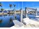 Modern boat lift, providing convenience for boating enthusiasts in this waterfront community at 2180 Via Esplanade, Punta Gorda, FL 33950