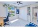 Bright office space with ample storage including a floor to ceiling cabinet and shelving unit at 2180 Via Esplanade, Punta Gorda, FL 33950