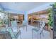 Cozy outdoor patio with seating and view of the home's interior at 2180 Via Esplanade, Punta Gorda, FL 33950