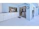 Enclosed outdoor patio featuring built-in cabinets and access to the yard at 2180 Via Esplanade, Punta Gorda, FL 33950