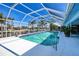 Enclosed pool with covered patio, overlooking waterfront canal with dock, perfect for outdoor relaxation at 2180 Via Esplanade, Punta Gorda, FL 33950