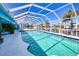 A pristine enclosed pool with calming blue waters, and views of the surrounding community's canals at 2180 Via Esplanade, Punta Gorda, FL 33950