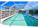 Spacious screened-in pool offering a view of the canal and a covered lanai for relaxing at 2180 Via Esplanade, Punta Gorda, FL 33950