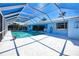 Enclosed pool area features a spacious deck and a sparkling pool perfect for relaxation and entertaining at 2180 Via Esplanade, Punta Gorda, FL 33950