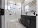 Modern bathroom with walk-in shower and dual sink vanity at 24473 San Rafael Rd, Punta Gorda, FL 33955