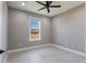 Bedroom with ceiling fan, window, and neutral walls at 24473 San Rafael Rd, Punta Gorda, FL 33955