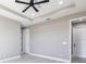 Neutral bedroom with fan and two doors at 24473 San Rafael Rd, Punta Gorda, FL 33955