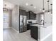 Modern kitchen features stainless steel appliances, sleek countertops, and pendant lighting at 24473 San Rafael Rd, Punta Gorda, FL 33955