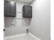 Functional laundry room with hanging rack and convenient storage at 24473 San Rafael Rd, Punta Gorda, FL 33955