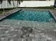 A rejuvenating pool with fountain features, surrounded by stylish pavers at 24473 San Rafael Rd, Punta Gorda, FL 33955