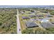 Aerial shot of beautiful single story homes with a parking lot, community pool, and green space at 24540 Harborview Rd # D4, Punta Gorda, FL 33980