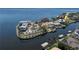 Aerial view of waterfront homes with private boat docks and beautiful landscaping in a waterfront community at 250 George Rd, Port Charlotte, FL 33952
