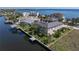 Aerial view of waterfront home with defined lot showcasing backyard dock and access to the waterway at 250 George Rd, Port Charlotte, FL 33952