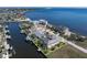 Captivating aerial view of a waterfront residence surrounded by lush landscaping and pristine waterways at 250 George Rd, Port Charlotte, FL 33952