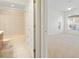 Bathroom featuring a vanity with cabinet, a bathtub with shower, and a connecting door at 250 George Rd, Port Charlotte, FL 33952