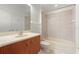 Bathroom featuring a vanity with cabinet, a bathtub with shower, and neutral tiling at 250 George Rd, Port Charlotte, FL 33952