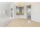 Sunlit breakfast nook features tile flooring, corner windows, and a convenient door to the outdoor space at 250 George Rd, Port Charlotte, FL 33952