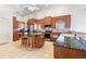 Spacious kitchen with stainless steel appliances, a center island, and tile floors at 250 George Rd, Port Charlotte, FL 33952