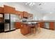 Spacious kitchen boasts modern appliances, a center island, and tile flooring, perfect for culinary adventures at 250 George Rd, Port Charlotte, FL 33952