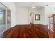 Bright living room features gleaming hardwood floors, high ceilings, and sliding doors to a spacious balcony at 250 George Rd, Port Charlotte, FL 33952