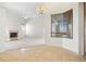 Open living space with tile and carpet, fireplace, modern chandelier and plenty of natural light at 250 George Rd, Port Charlotte, FL 33952