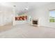 Open concept living room with fireplace and view of the kitchen at 250 George Rd, Port Charlotte, FL 33952