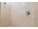 The shower features beige tiling and chrome fixtures at 250 George Rd, Port Charlotte, FL 33952