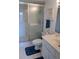Clean bathroom with a glass-enclosed shower and functional features at 25188 Marion Ave # F303, Punta Gorda, FL 33950