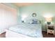 Cozy bedroom featuring a bright, colorful comforter and plenty of natural light at 257 Lido Dr, Punta Gorda, FL 33950