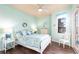Bright bedroom with coastal decor, a comfortable bed, and natural light at 257 Lido Dr, Punta Gorda, FL 33950