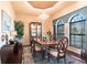 Formal dining room with hardwood floors, chandelier lighting, and large windows for natural light at 257 Lido Dr, Punta Gorda, FL 33950