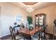 Elegant dining room featuring a chandelier, wood table, and glass display cabinet at 257 Lido Dr, Punta Gorda, FL 33950