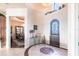 Grand foyer with tile flooring, high ceilings, and an arched doorway to the dining room at 257 Lido Dr, Punta Gorda, FL 33950