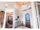 Elegant foyer with high ceilings, decorative lighting, arched doorway and a decorative wrought iron door at 257 Lido Dr, Punta Gorda, FL 33950