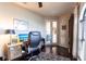 Well-lit home office with a wooden desk, ergonomic chair, and modern computer setup at 257 Lido Dr, Punta Gorda, FL 33950