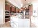Beautiful kitchen featuring custom cabinets, granite countertops, stainless steel appliances, and an island with seating at 257 Lido Dr, Punta Gorda, FL 33950